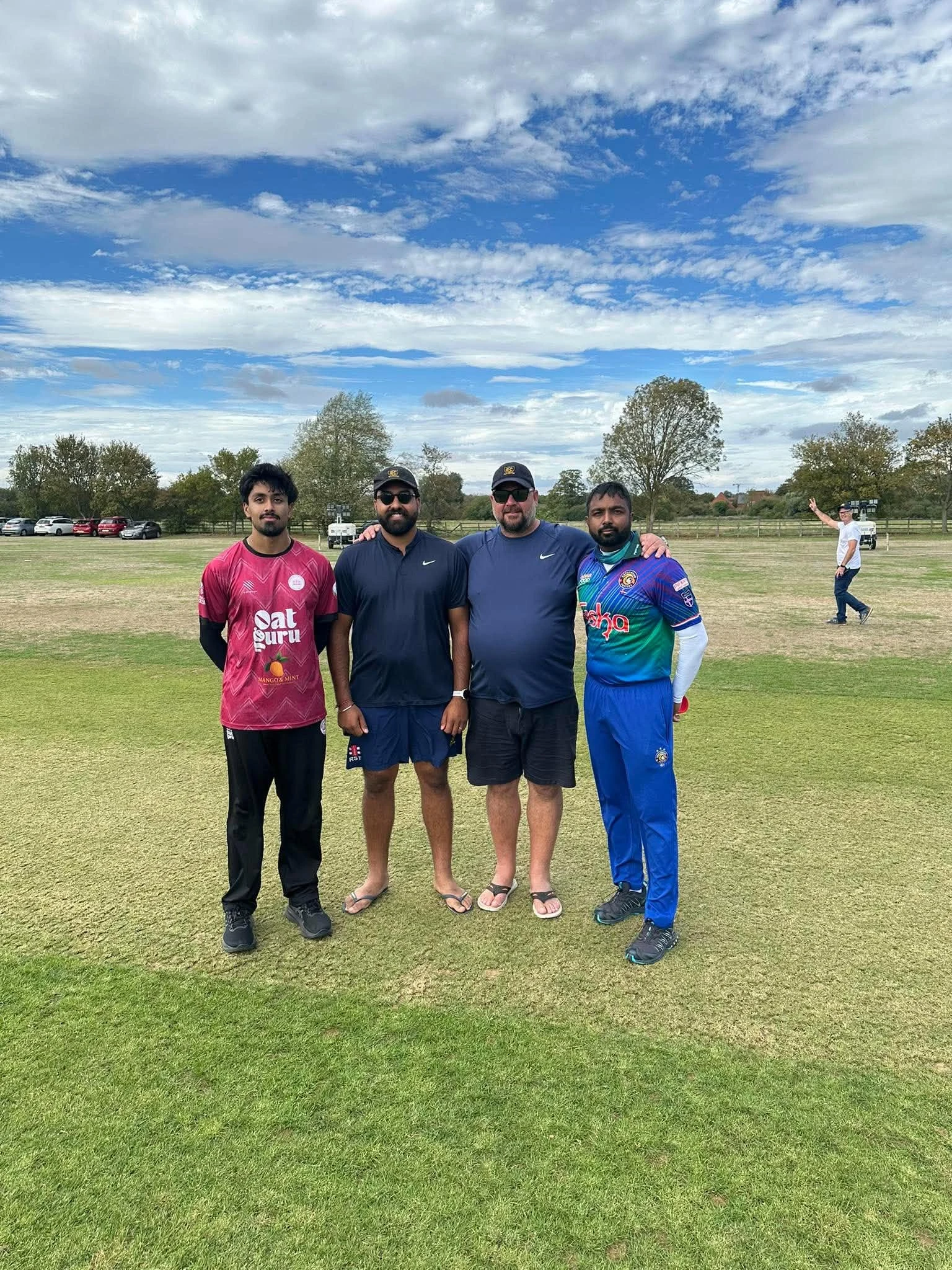 Players and friends together on the cricket ground during the Puffins’ 2026 UK tour